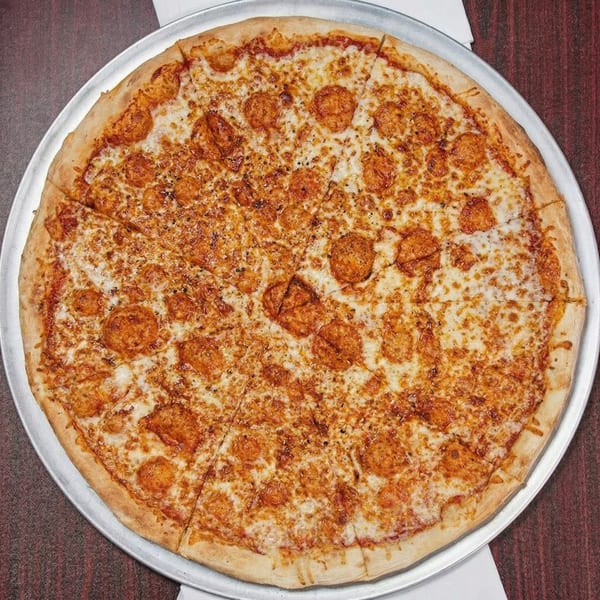 A large, round cheese pizza with a golden crust, cut into slices on a metal tray.